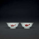 A VERY RARE PAIR OF LARGE COPPER-RED DECORATED ‘THREE FISH’ BOWLS - photo 1
