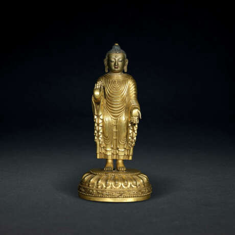 A VERY RARE EARLY-MING GILT-BRONZE STANDING FIGURE OF MAITREYA - photo 1