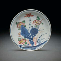 A RARE ENAMELLED BLUE AND WHITE SAUCER DISH