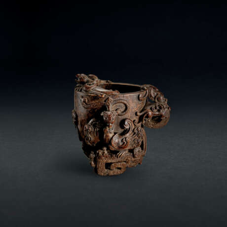 A CARVED ALOESWOOD ‘DRAGON AND PHOENIX’ LIBATION CUP - photo 1
