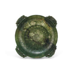 A SPINACH-GREEN JADE CHRYSANTHEMUM-FORM WASHER