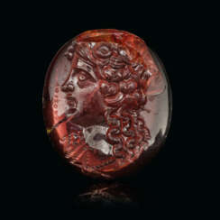 A ROMAN GARNET RINGSTONE WITH A FEAMLE HEAD SIGNED BY EUDOSIOS