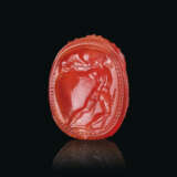 AN ETRUSCAN CARNELIAN SCARAB WITH HERCLE CARRYING A BOULDER - фото 1