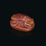 A GREEK CARNELIAN SCARAB WITH A YOUTH LEANING ON A STAFF - photo 2