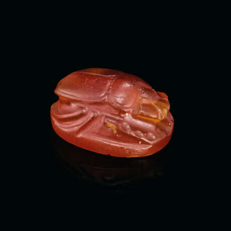 A GREEK CARNELIAN SCARAB WITH A YOUTH LEANING ON A STAFF - photo 2