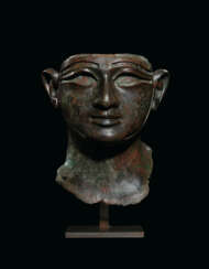 AN EGYPTIAN BRONZE HEAD OF A KING