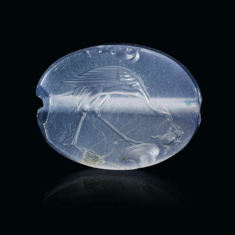 A GREEK BLUE CHALCEDONY SCARABOID WITH A HERON CATCHING A FROG - photo 1