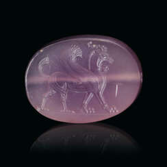 A GRECO-PERSIAN VIOLET CHALCEDONY SCARABOID WITH A LION-GRIFFIN