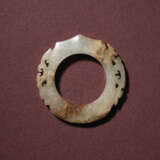 A WHITE JADE RETICULATED ARCHER’S RING, SHE - photo 1