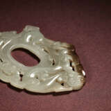 A WHITE JADE ‘CHI DRAGON AND PHOENIX’ RETICULATED PENDANT - photo 2