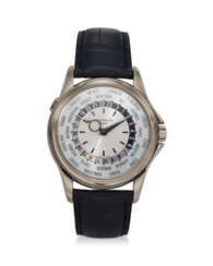 PATEK PHILIPPE, REF. 5130G-001, A FINE 18K WHITE GOLD WORLD TIME WRISTWATCH WITH SILVER DIAL