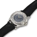 PATEK PHILIPPE, REF. 5110P-001, A VERY FINE PLATINUM WORLD TIME WRISTWATCH WITH BLUE DIAL - фото 3