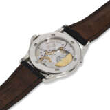 PATEK PHILIPPE, REF. 5110P-001, A VERY FINE PLATINUM WORLD TIME WRISTWATCH WITH BLUE DIAL - photo 5