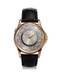 PATEK PHILIPPE, REF. 5130R-001, A FINE 18K ROSE GOLD WORLD TIME WRISTWATCH WITH SILVER GUILLOCHE DIAL