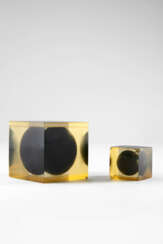 Lot of two transparent amber polyester resin cubes containing matte black resin spheres