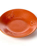 Анджело Бьянчини. Red-orange glazed ceramic plate decorated with relief fruits