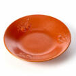 Red-orange glazed ceramic plate decorated with relief fruits - Archives des enchères