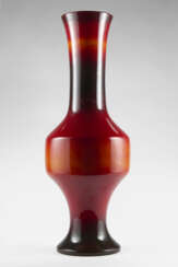 Large ceramic vase enamelled in shades of red brown, orange under showcase