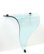 Nicoletti. Curved and ground crystal console table shaped into a triangle, brass and metal fixing studs