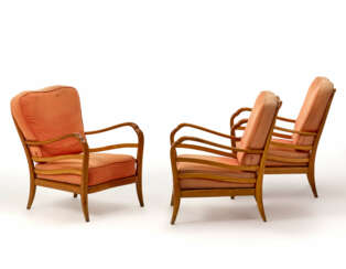 Three armchairs with light woodstructure, cushions upholstered and covered in salmon fabric