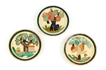 Three polychrome glazed earthenware plates engraved with naturalistic motifs