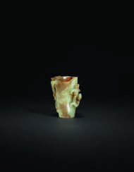 A PALE GREYISH-GREEN AND RUSSET JADE ARCHAISTIC &#39;CHILONG&#39; CUP