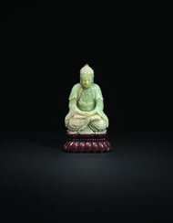 A PALE GREENISH-WHITE JADE SEATED FIGURE OF BUDDHA
