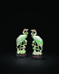A PAIR OF MOTTLED PALE AND APPLE-GREEN JADEITE MODELS OF CRANES