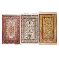 3 Oriental silk carpets. HEREKE: