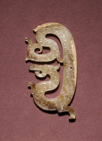 A RETICULATED JADE DRAGON-FORM PENDANT - photo 1