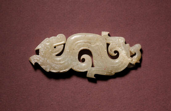 A RARE JADE RETICULATED ‘DRAGON AND MONKEY’ PENDANT - photo 1