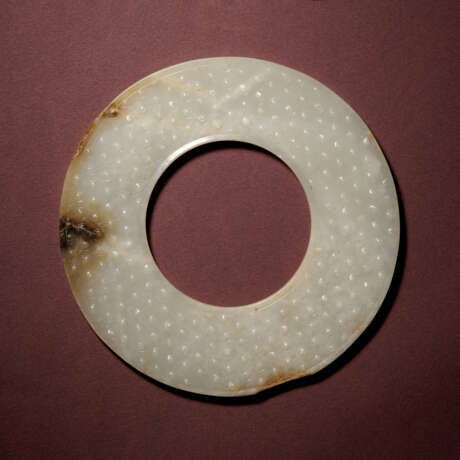 A WHITE AND RUSSET JADE RING, HUAN - photo 1