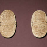 TWO JADE SHIELD-FORM ORNAMENTS - photo 1