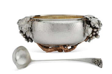 AN AMERICAN SILVER AND COPPER TWO HANDLED PUNCH BOWL AND LADLE