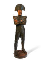 A CARVED AND PAINT-DECORATED WALNUT TRADE FIGURE OF NAPOLEON