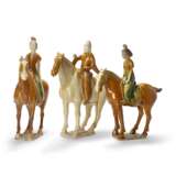 A GROUP OF THREE TANG-STYLE SANCAI-GLAZED POTTERY EQUESTRIAN FIGURES - photo 1