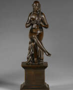 Barthélemy Prieur. A BRONZE FIGURE OF A SEATED NUDE WOMAN BRAIDING HER HAIR