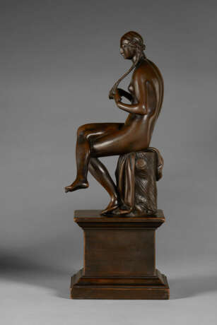 A BRONZE FIGURE OF A SEATED NUDE WOMAN BRAIDING HER HAIR - photo 4