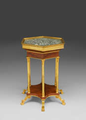 A CONSULAT ORMOLU-MOUNTED MAHOGANY AND GRANIT OBICULAIRE GUERIDON