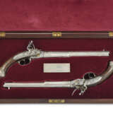 AN EXTREMELY FINE & IMPORTANT PAIR OF ITALIAN LORENZONI SYSTEM SILVER-MOUNTED BREECH-LOADING REPEATING FLINTLOCK PISTOLS - фото 1