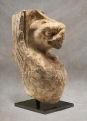 A ROMAN MARBLE INSCRIBED TRAPEZOPHOROS IN THE FORM OF A GRIFFIN