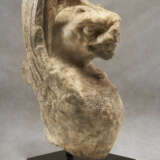 A ROMAN MARBLE INSCRIBED TRAPEZOPHOROS IN THE FORM OF A GRIFFIN - photo 1