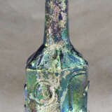 A ROMAN MOLD-BLOWN BLUE GLASS HEXAGONAL BOTTLE WITH DIONYSIAC SYMBOLS - photo 2