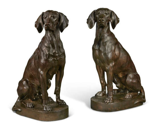 A PAIR OF PATINATED BRONZE MODELS OF SEATED HOUNDS - фото 1