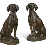 A PAIR OF PATINATED BRONZE MODELS OF SEATED HOUNDS - фото 1