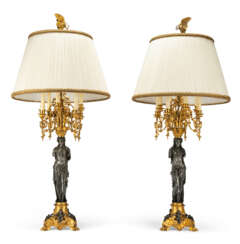 A PAIR OF LOUIS XV-STYLE ORMOLU AND PATINATED-BRONZE EIGHT-LIGHT CANDELABRA, ADAPTED AS LAMPS