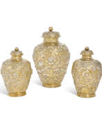 Stuart Restoration in England. A SET OF THREE CHARLES II SILVER-GILT FURNISHING VASES AND COVERS