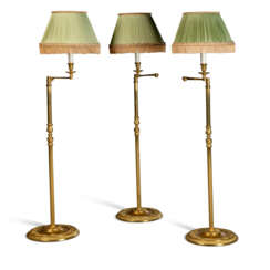 THREE LACQUERED-BRASS ADJUSTABLE FLOOR LAMPS