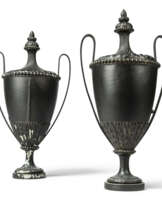 A PAIR OF EBONISED-WOOD AND IRON URNS