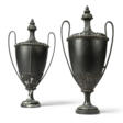 A PAIR OF EBONISED-WOOD AND IRON URNS - Prix ​​des enchères